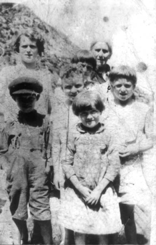 288: l-r front - Thomas Anthony Norman, Sarah Norman; middle - Calvin White, Mary Mulrooney, back -  Mame Norman, Carmel Mulrooney, Alice (Norman) Mulrooney. (circa 1930) [courtesy of Sadie (Norman)  Kerrivan]  - Thomas and Sarah children of Thomas Norman &amp;amp; Jane Traverse, Sarah married Leo Kerrivan;  Calvin son of James White &amp;amp; Mary Anne Mulrooney; Mary and Carmel daughters of James Mulrooney  &amp;amp; Mary Joseph Corrigan, Mary married Ambrose Bishop, Carmel married David Barry; Mame daughter  of Garrett Norman &amp;amp; Bridget Whelan, Mame married William Doyle; Alice daughter of Thomas Norman  &amp;amp; Anne Dunphy, Alice married Patrick Mulrooney, Alice was grandmother of Calvin, Mary &amp;amp; Carmel